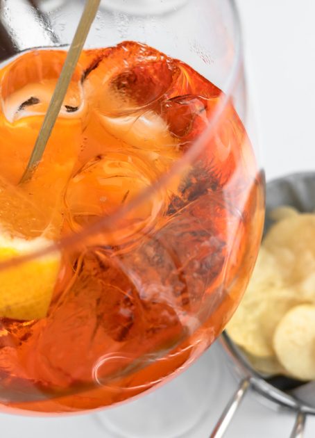Spritz cocktail Classic italian spritz cocktail with chips. Copy space.